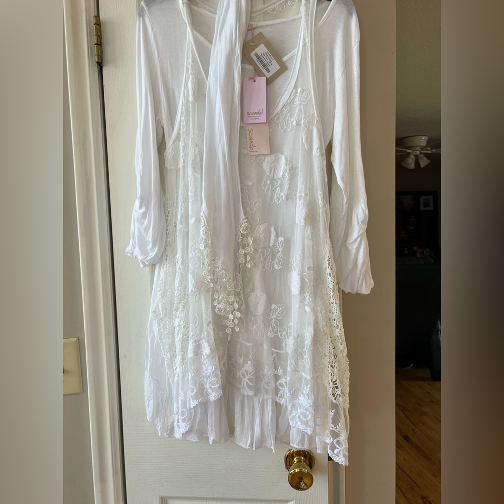 Scandal sleeveless lace vest and 3 quarter length whir shirt with add on scarf.